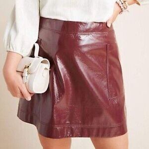 sleek faux leather autumnal plum Anthropologie skirt